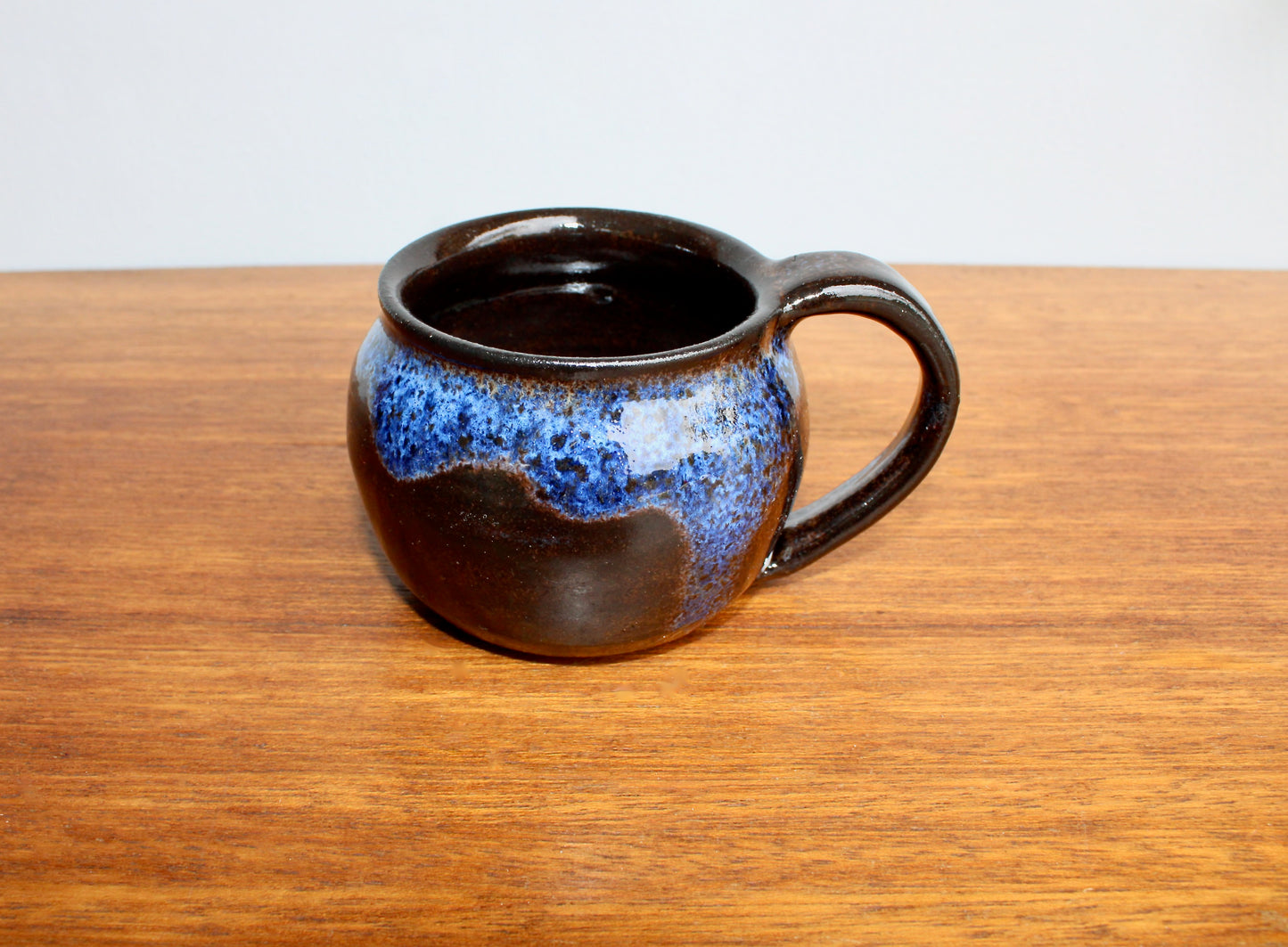 250ml Capacity Globe Mug, Dark Clay w/ Glassy Marbled Blue Glazed Rim-Drip Glaze, Dark Dark Stoneware Rounded Mug, Glossy Nearly Black Mug