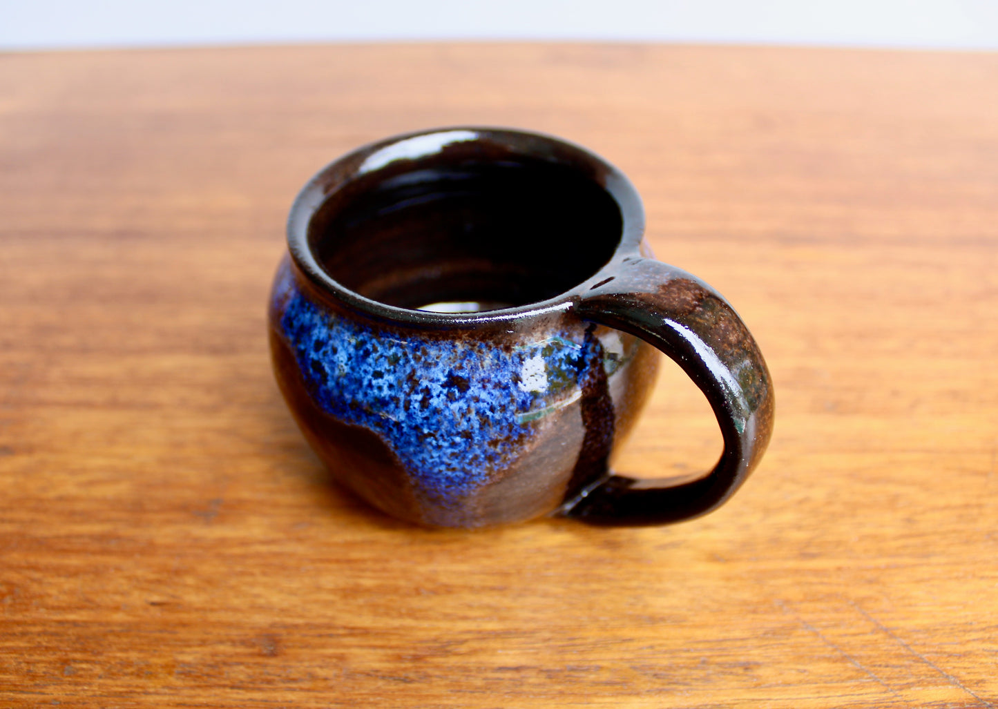 250ml Capacity Globe Mug, Dark Clay w/ Glassy Marbled Blue Glazed Rim-Drip Glaze, Dark Dark Stoneware Rounded Mug, Glossy Nearly Black Mug