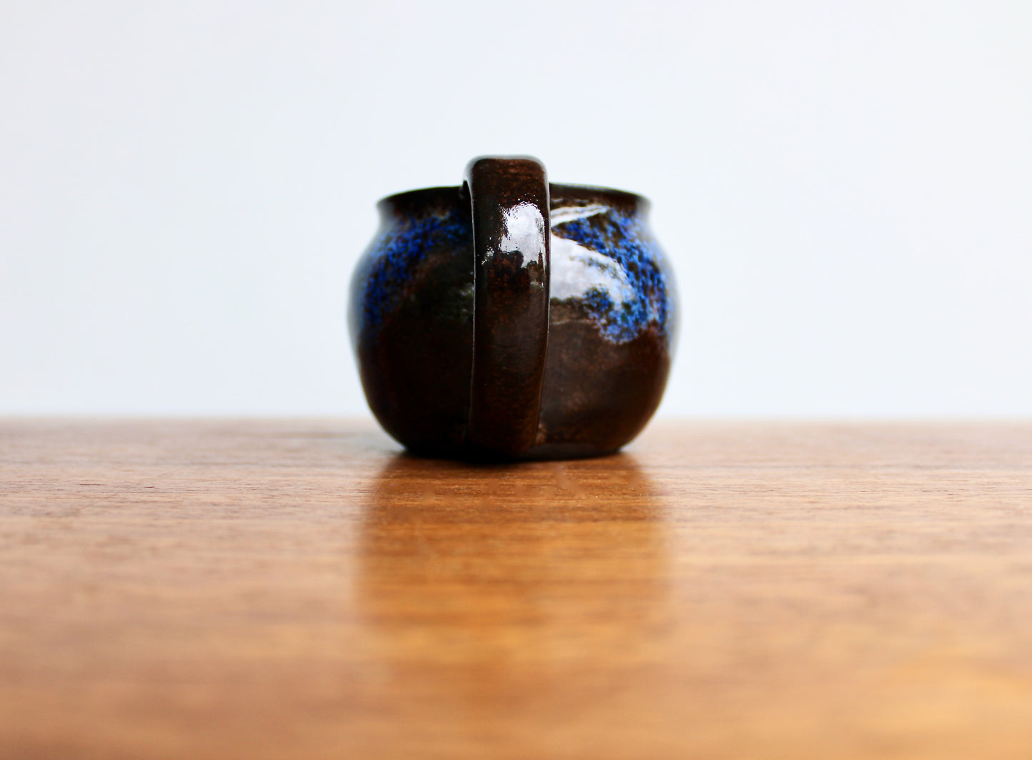 250ml Capacity Globe Mug, Dark Clay w/ Glassy Marbled Blue Glazed Rim-Drip Glaze, Dark Dark Stoneware Rounded Mug, Glossy Nearly Black Mug
