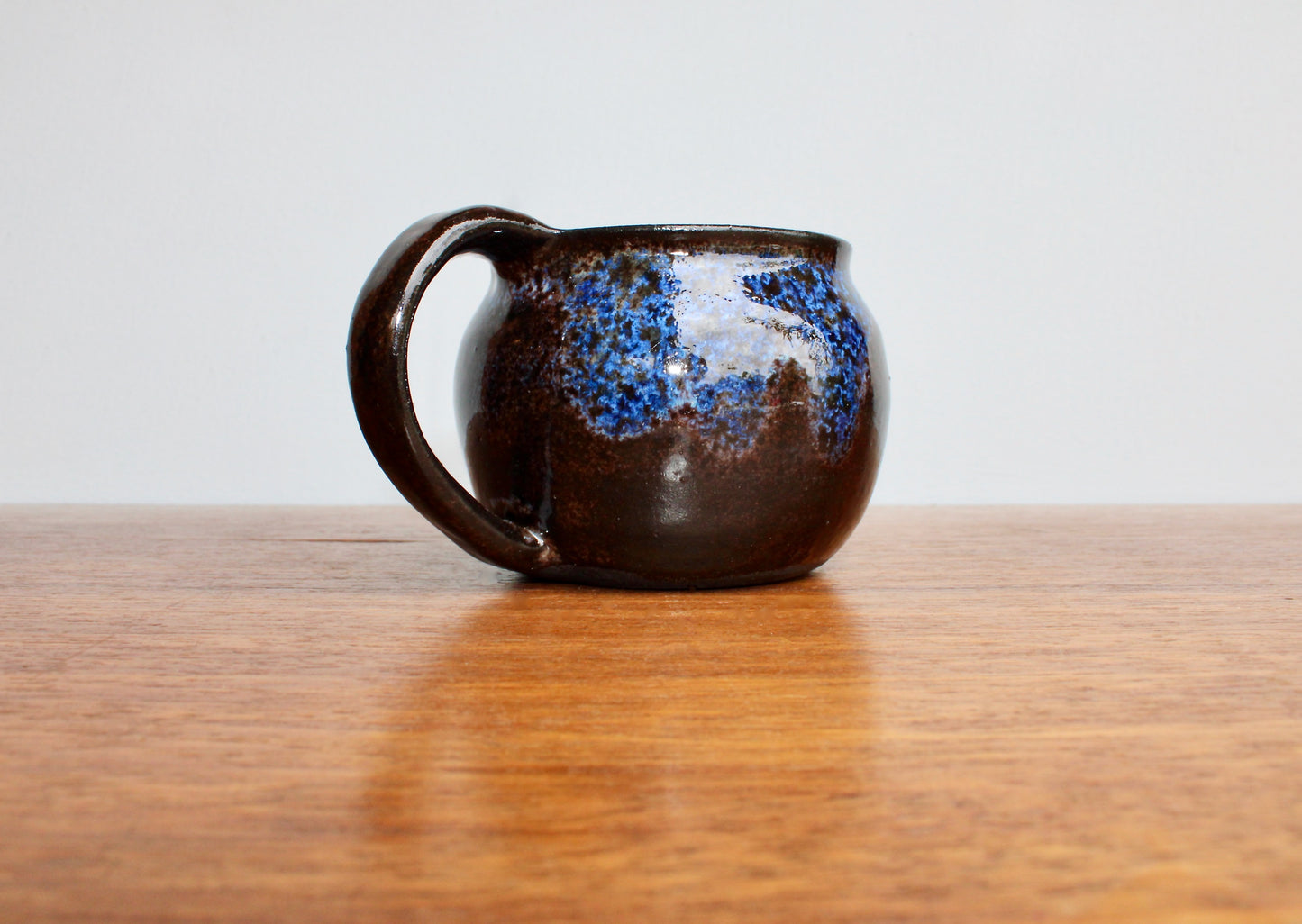250ml Capacity Globe Mug, Dark Clay w/ Glassy Marbled Blue Glazed Rim-Drip Glaze, Dark Dark Stoneware Rounded Mug, Glossy Nearly Black Mug