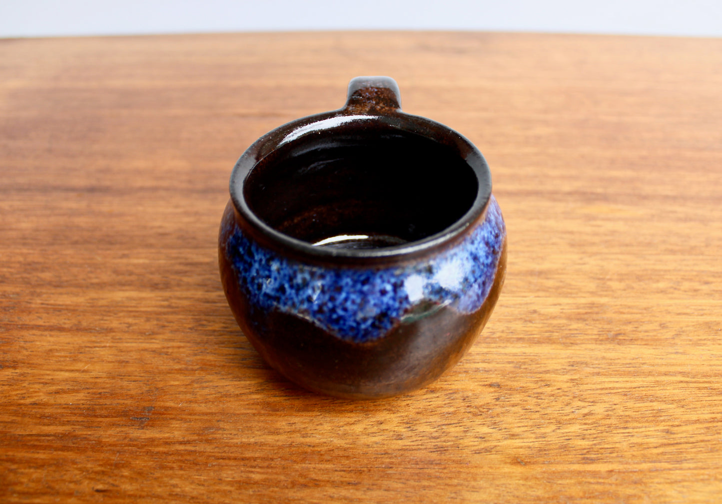 250ml Capacity Globe Mug, Dark Clay w/ Glassy Marbled Blue Glazed Rim-Drip Glaze, Dark Dark Stoneware Rounded Mug, Glossy Nearly Black Mug
