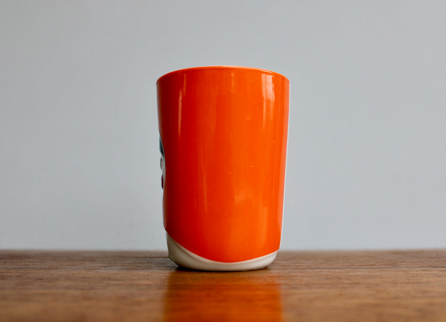 QDO Folklore Collection - 21st Century Benneton-Style Design Think-Tank - QDO (Copenhagen 2004) Quality Porcelain - Orange Variant Sofia Kokeshi Double-Walled Cup in Orange & Black