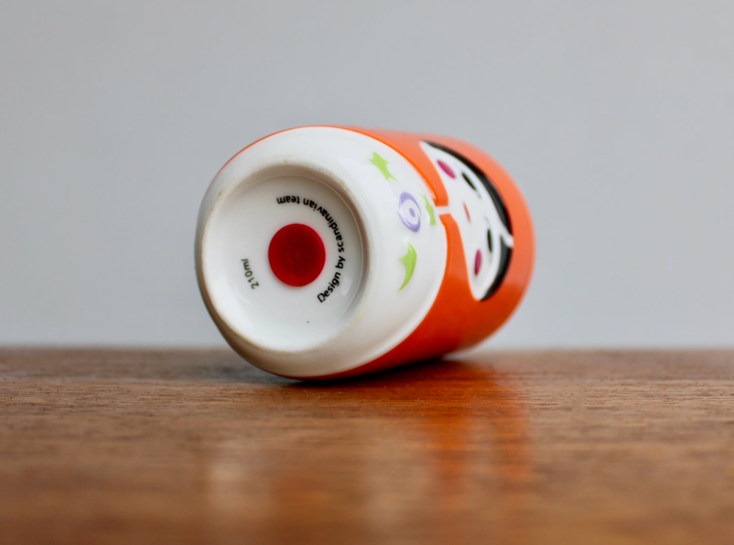 QDO Folklore Collection - 21st Century Benneton-Style Design Think-Tank - QDO (Copenhagen 2004) Quality Porcelain - Orange Variant Sofia Kokeshi Double-Walled Cup in Orange & Black