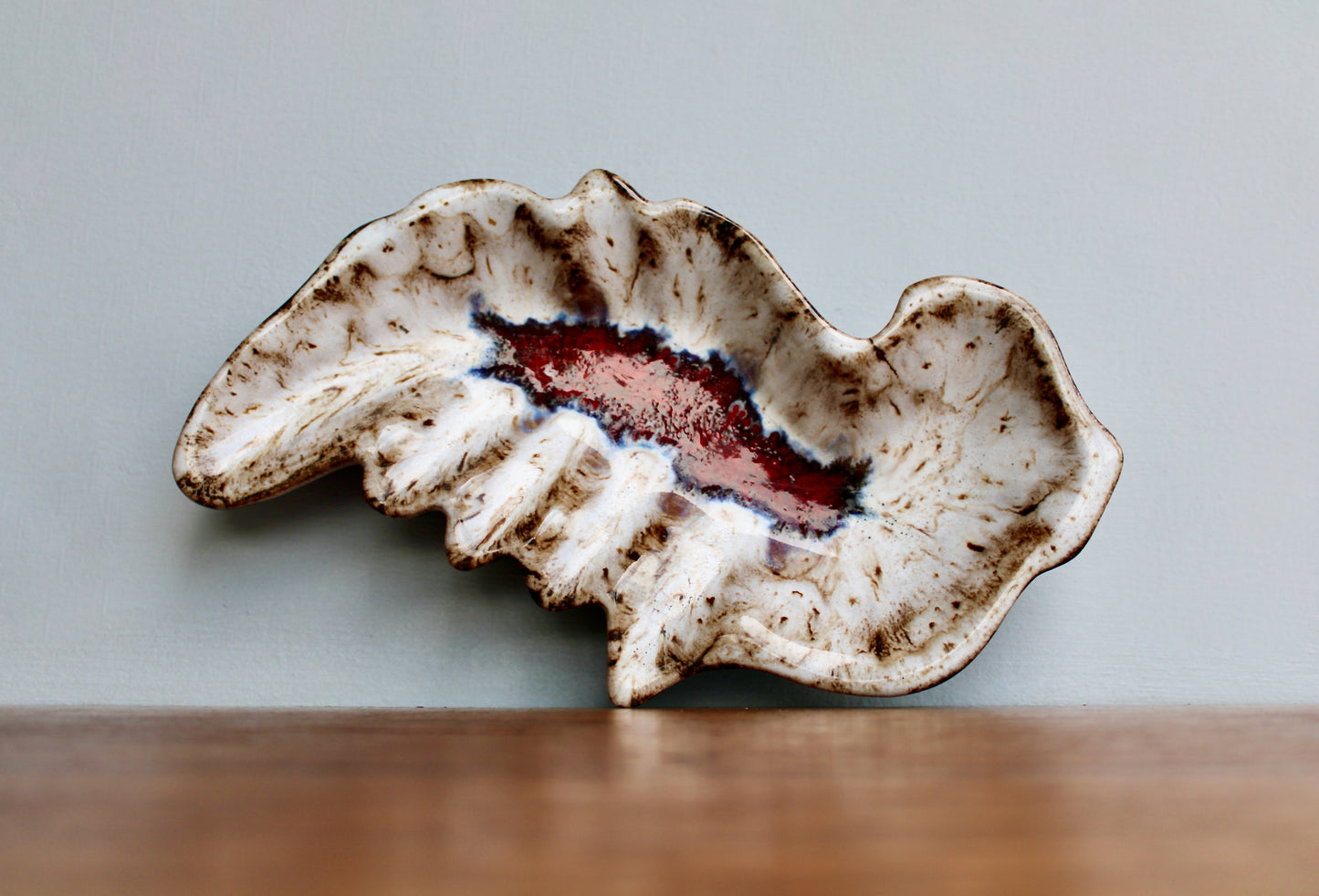 MCM California Pottery Biomorphic Shaped Ashtray in Rich Lava Glaze & Ruby Glass-Frit Interior Base