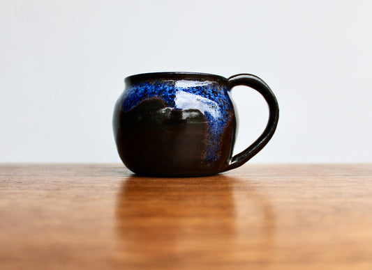 250ml Capacity Globe Mug, Dark Clay w/ Glassy Marbled Blue Glazed Rim-Drip Glaze, Dark Dark Stoneware Rounded Mug, Glossy Nearly Black Mug